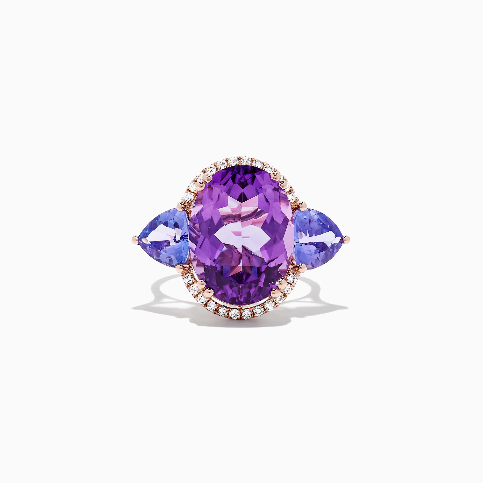 The 14K Rose Gold Amethyst, Tanzanite and Diamond Ring, 10.28 TCW features a striking amethyst center, accented by tanzanites and surrounded by a sparkling diamond halo.