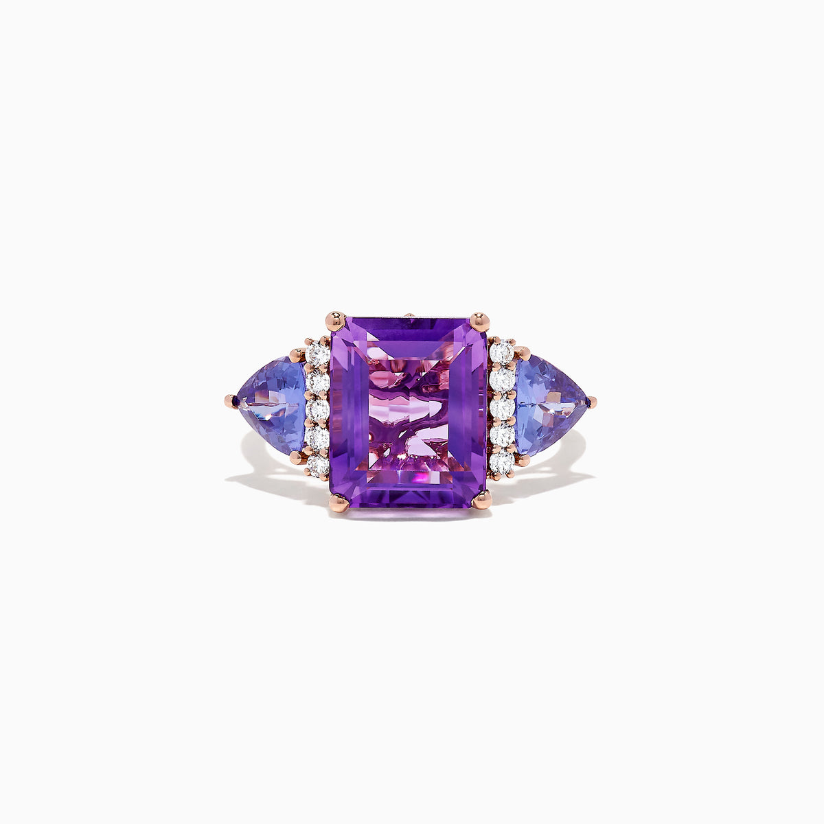The 14K Rose Gold Amethyst, Tanzanite and Diamond Ring (7.49 TCW) showcases a large rectangular amethyst center, two triangular tanzanites, and four round diamonds on each side, all set against a white background.