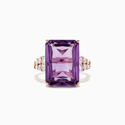 The 14K Rose Gold Amethyst and Diamond Cocktail Ring, 11.94 TCW, showcases a large rectangular-cut amethyst accented by round and baguette diamonds on the band, set in rose gold and displayed on a white background.