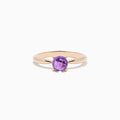 A 14K rose gold ring features a round-cut amethyst gemstone (0.81 TCW) in a classic prong setting against a white background—an elegant Amethyst Ring perfect for any occasion.