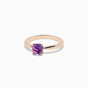 A 14K rose gold ring features a round-cut amethyst gemstone (0.81 TCW) in a classic prong setting against a white background—an elegant Amethyst Ring perfect for any occasion.