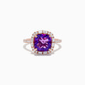 The 14K Rose Gold Amethyst and Diamond Ring showcases a large cushion-cut purple amethyst center, accented by small baguette and round diamonds, against a plain white background.