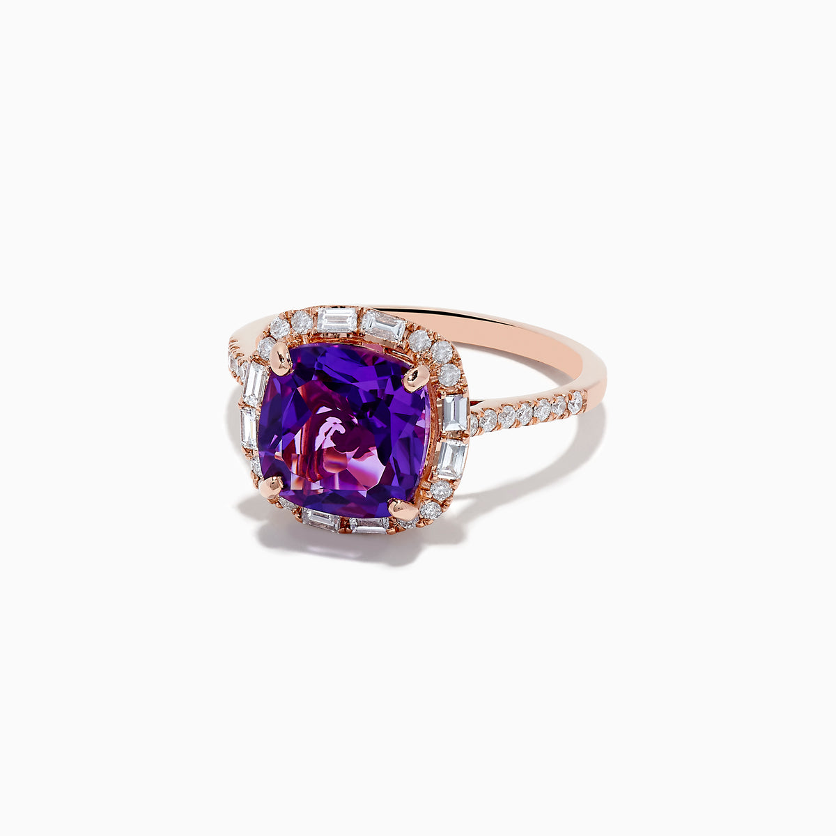 The 14K Rose Gold Amethyst and Diamond Ring showcases a large cushion-cut purple amethyst center, accented by small baguette and round diamonds, against a plain white background.