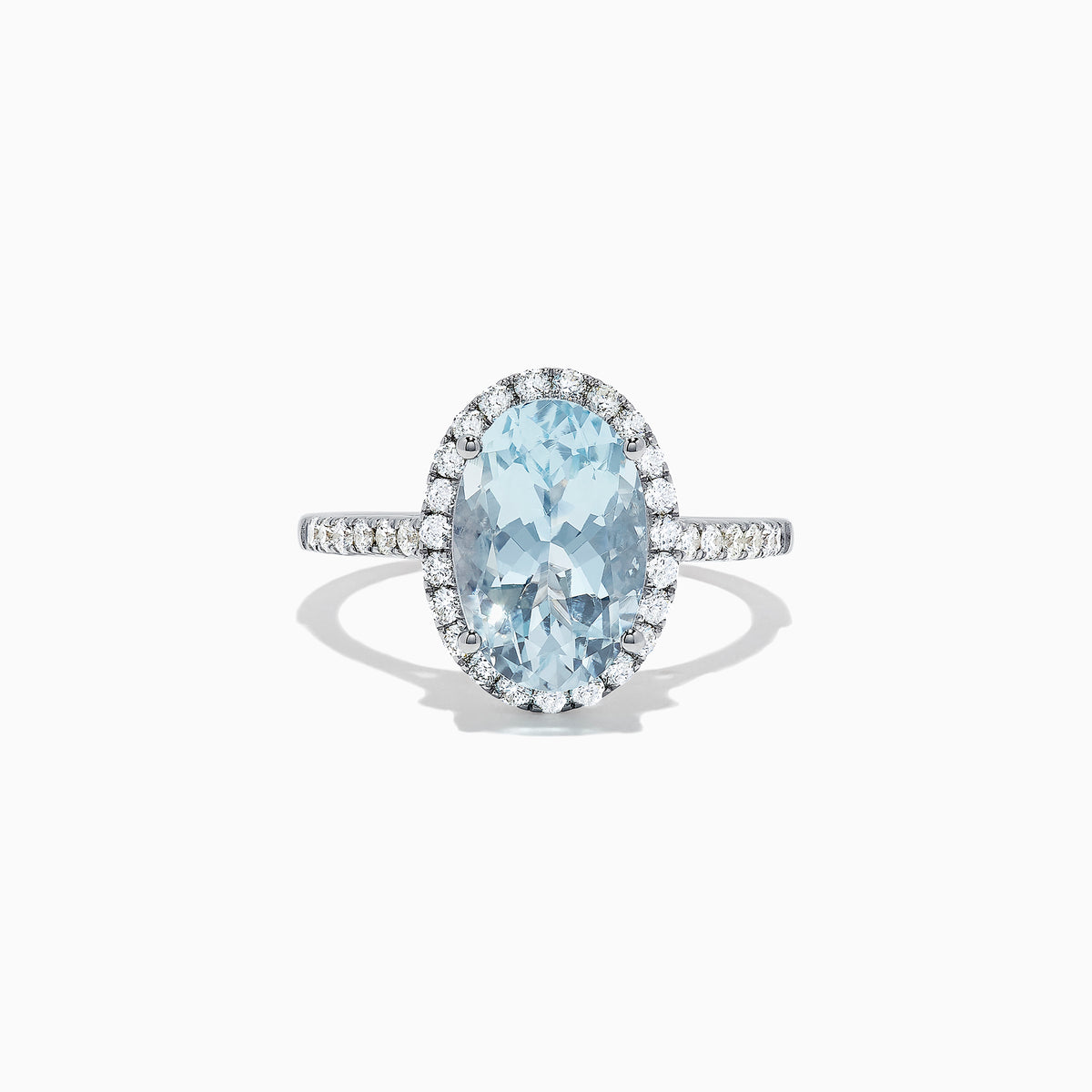 The Aquarius 14K White Gold Aquamarine and Diamond Ring, 3.45 TCW, showcases a large oval aquamarine center with a halo of sparkling round diamonds and additional diamonds along the sleek white gold band.