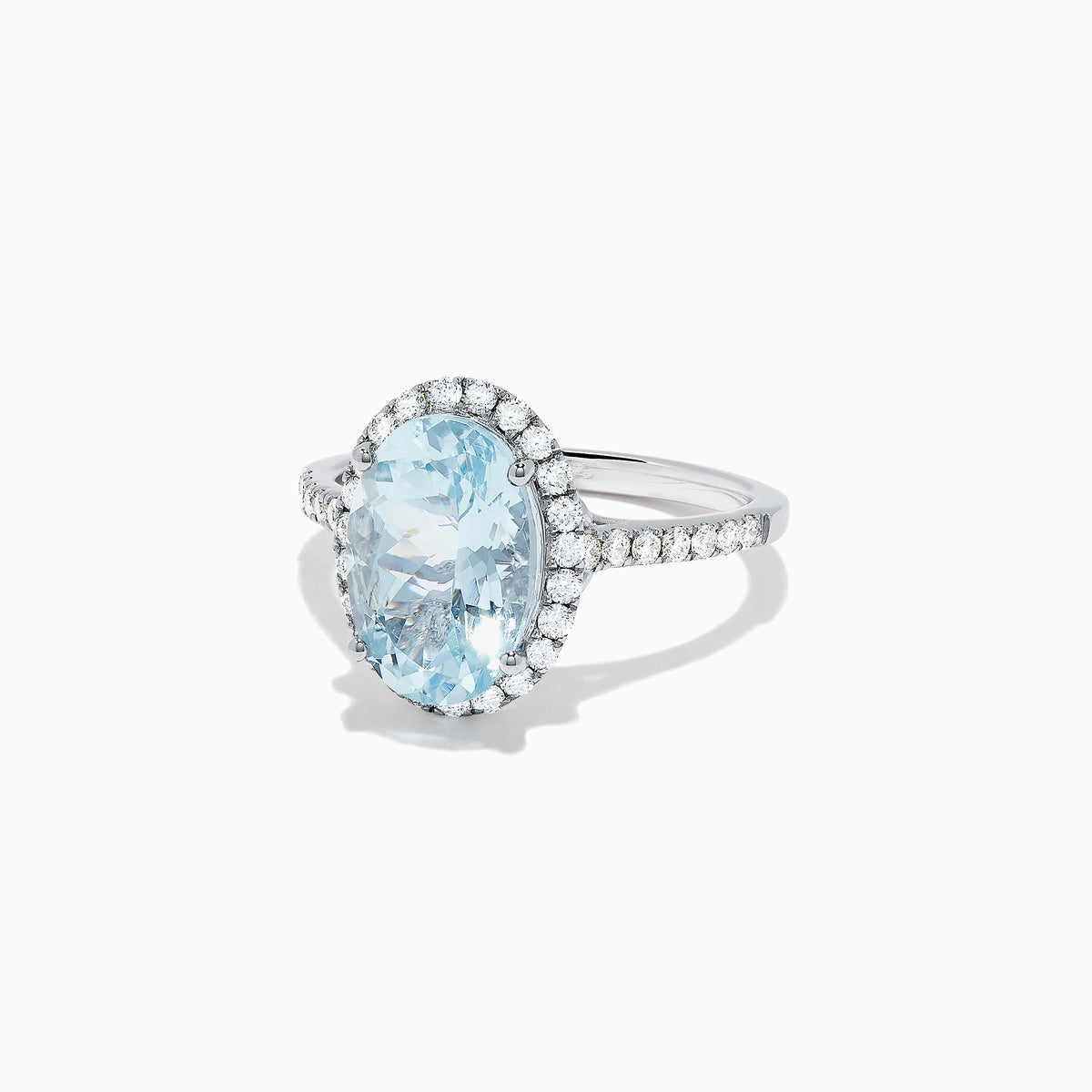 The Aquarius 14K White Gold Aquamarine and Diamond Ring, 3.45 TCW, showcases a large oval aquamarine center with a halo of sparkling round diamonds and additional diamonds along the sleek white gold band.