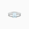 The Aquarius 14K Gold Aquamarine and Diamond Ring Set features a rectangular aquamarine centerpiece with two diamond-accented bands, shown against a plain white background.