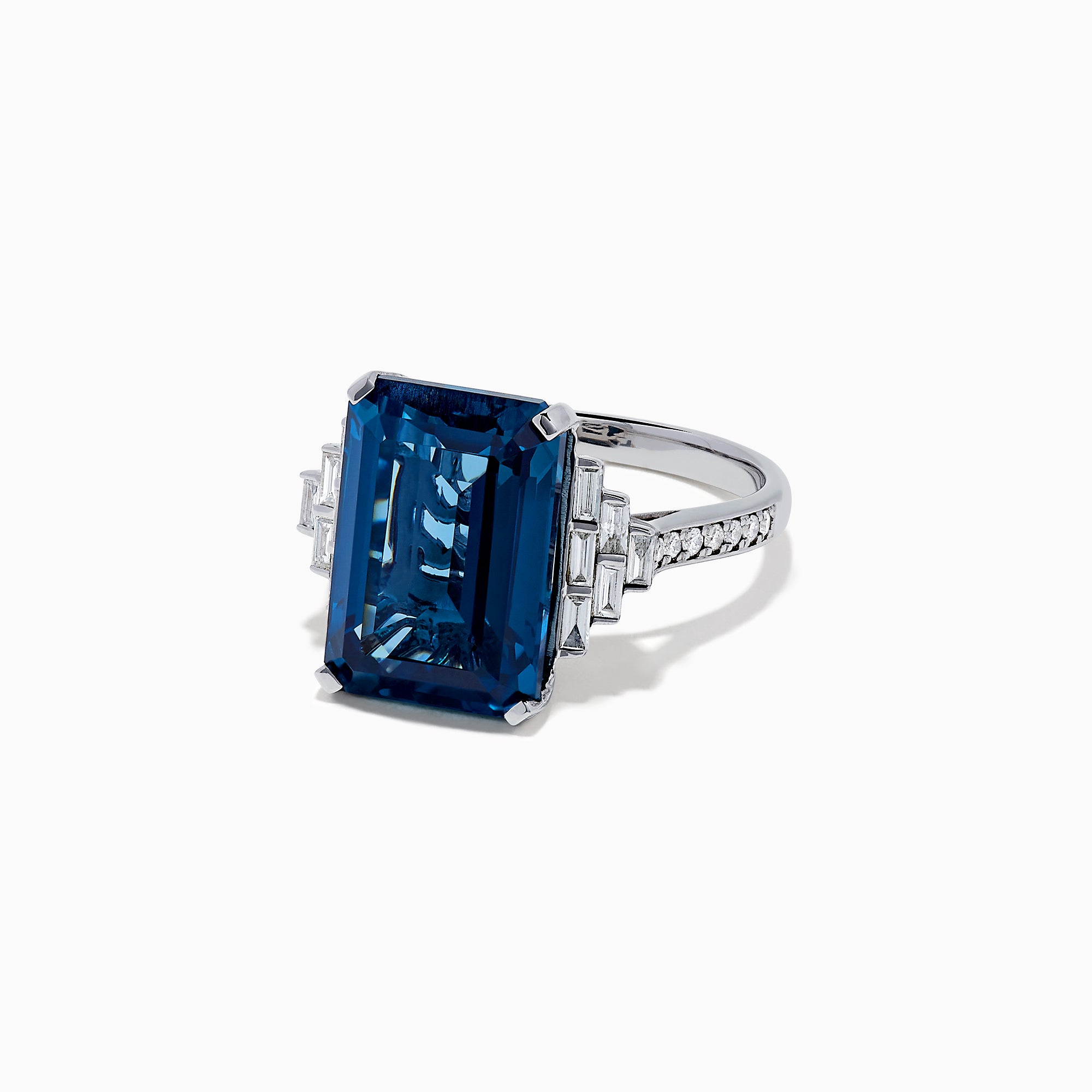 The Ocean Bleu 14K White Gold London Blue Topaz and Diamond Ring, 8.92 TCW, features a large rectangular blue topaz flanked by stepped baguette-cut diamonds, showcased on a white background.