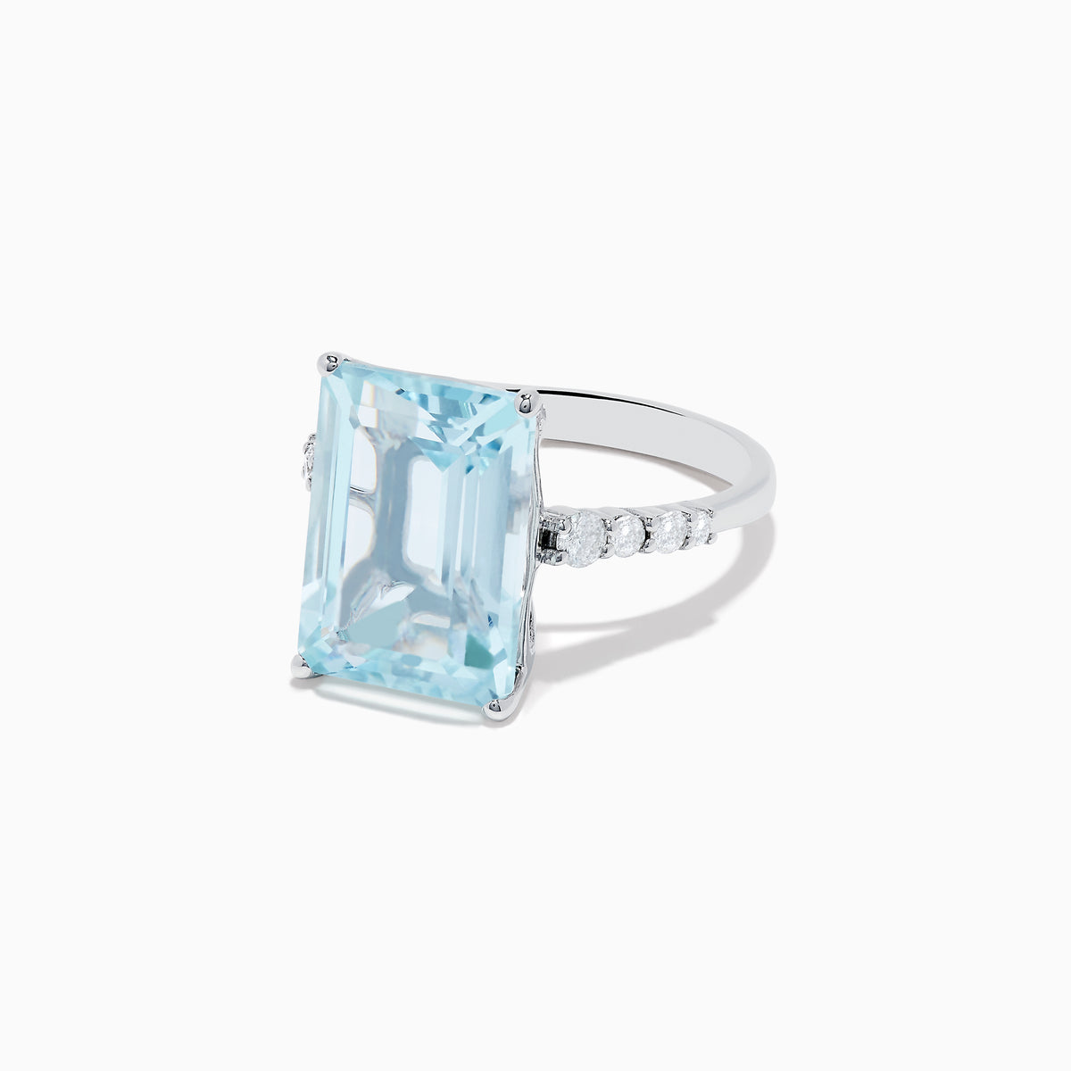 The Aquarius 14K White Gold Aquamarine and Diamond Cocktail Ring features a large rectangular aquamarine center stone flanked by round diamonds, all set in white gold and shown against a white background.