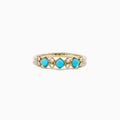 The 14K Yellow Gold Turquoise and Diamond Ring, 0.39 TCW, features three turquoise stones and six small round diamonds set in an alternating pattern along the band.