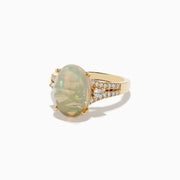 The Aurora 14K Yellow Gold Diamond and Opal Ring showcases a large oval opal center, accented by rows of sparkling diamonds on each side, all set in polished yellow gold.
