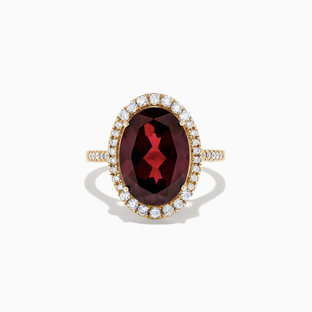 The Bordeaux 14K Yellow Gold Garnet and Diamond Cocktail Ring, 7.78 TCW, features a large oval deep red garnet encircled by a halo of sparkling diamonds, shown against a plain white background.