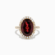 The Bordeaux 14K Yellow Gold Garnet and Diamond Cocktail Ring, 7.78 TCW, features a large oval deep red garnet encircled by a halo of sparkling diamonds, shown against a plain white background.