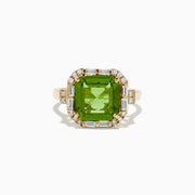 The 14K Yellow Gold Peridot and Diamond Ring showcases a large square-cut peridot center stone, accented by small round and rectangular diamonds, displayed on a plain white background.