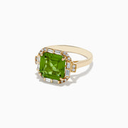 The 14K Yellow Gold Peridot and Diamond Ring showcases a large square-cut peridot center stone, accented by small round and rectangular diamonds, displayed on a plain white background.