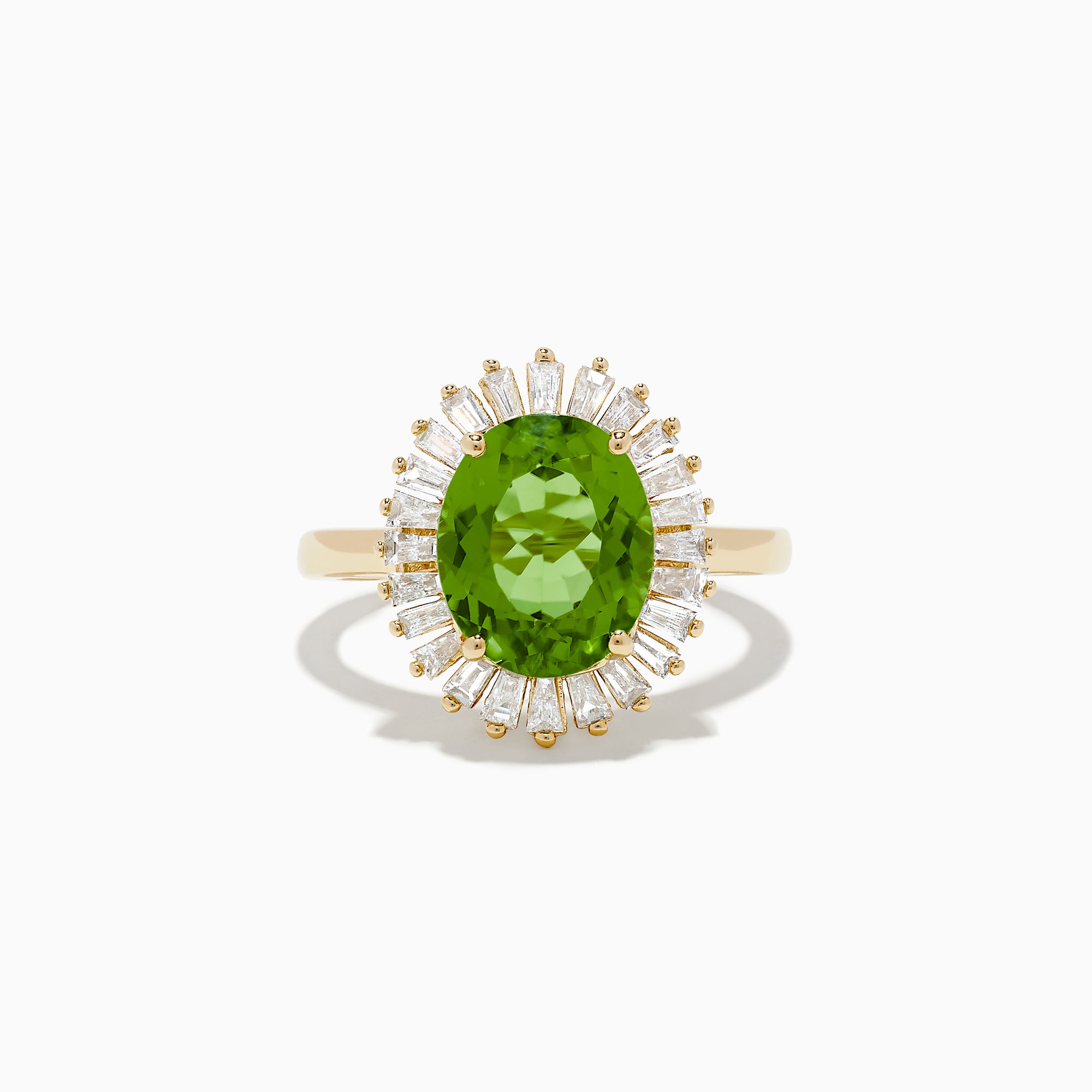 The 14K Yellow Gold Peridot and Diamond Ring features an oval peridot at the center, surrounded by a halo of baguette-cut diamonds, shown on a white background.