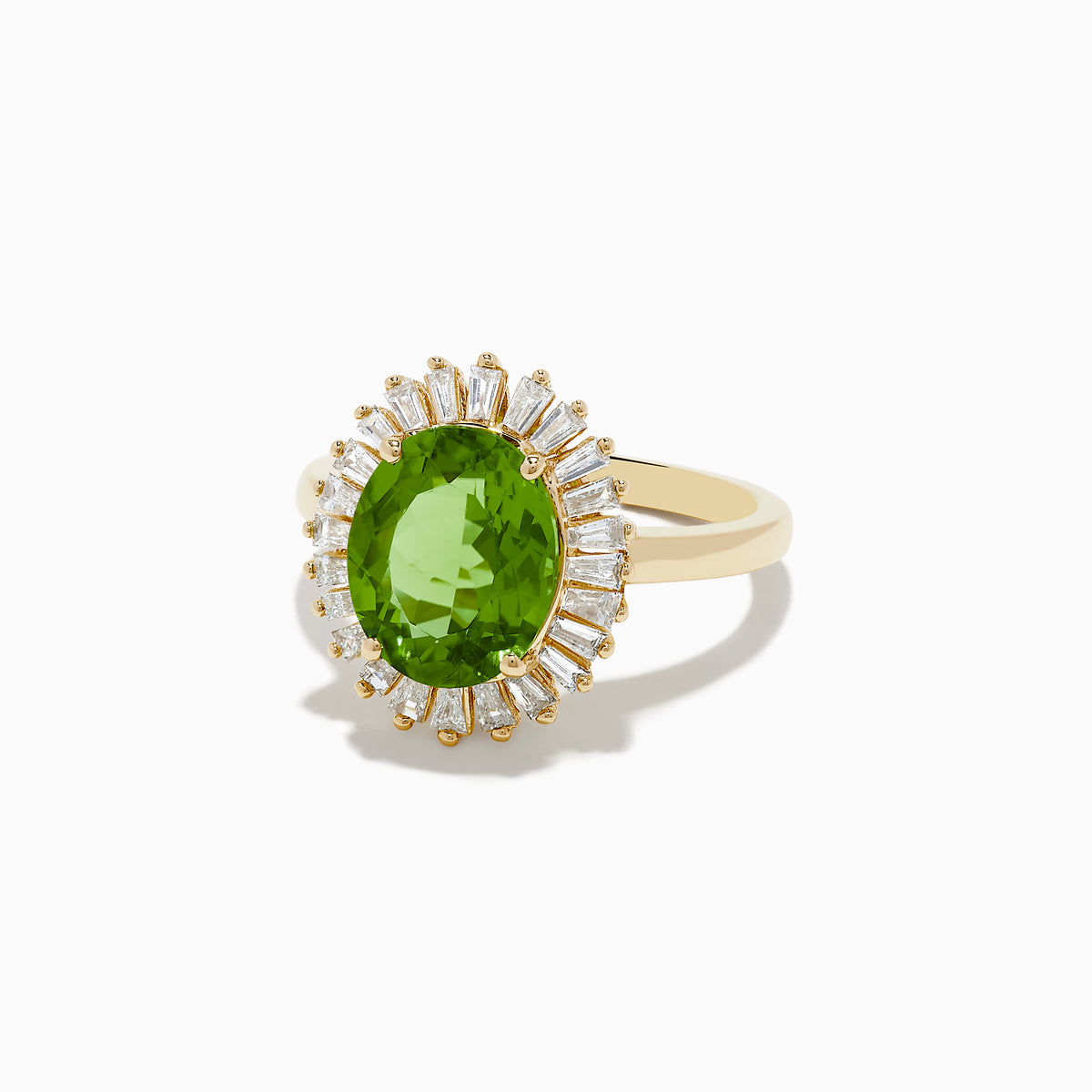 The 14K Yellow Gold Peridot and Diamond Ring features an oval peridot at the center, surrounded by a halo of baguette-cut diamonds, shown on a white background.