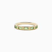 The 14K Yellow Gold Peridot Ring features a row of rectangular green peridot gemstones set around the band.