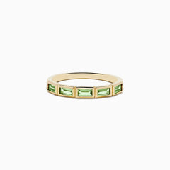 The 14K Yellow Gold Peridot Ring features a row of rectangular green peridot gemstones set around the band.