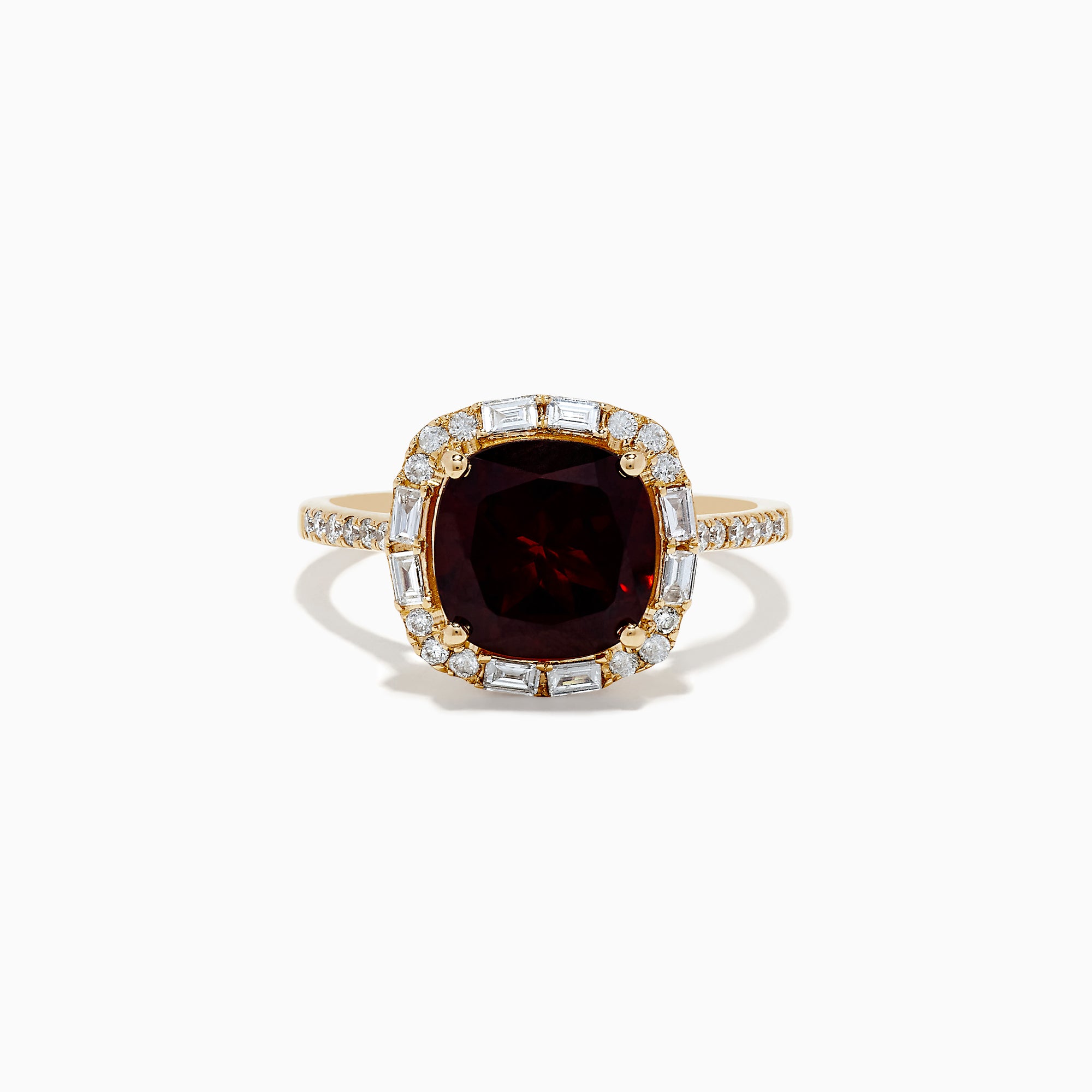 The 14K Yellow Gold Garnet and Diamond Ring features a cushion-cut deep red garnet center, surrounded by a halo of baguette and round white diamonds, with more diamonds set along the band.