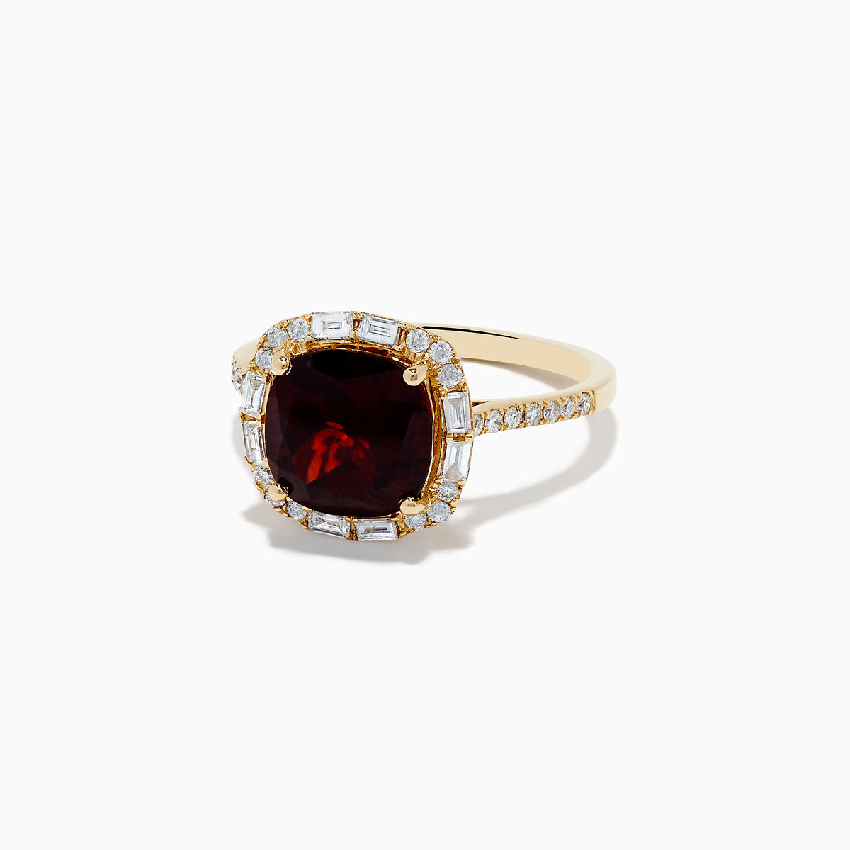 The 14K Yellow Gold Garnet and Diamond Ring features a cushion-cut deep red garnet center, surrounded by a halo of baguette and round white diamonds, with more diamonds set along the band.