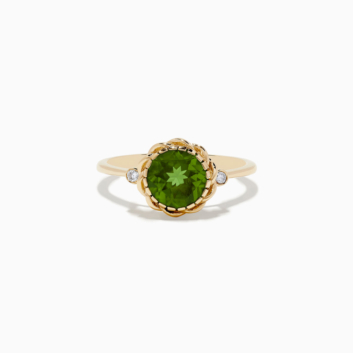 The 14K Yellow Gold Peridot and Diamond Ring showcases a round Peridot center stone with two small diamonds on each side, displayed against a white background.