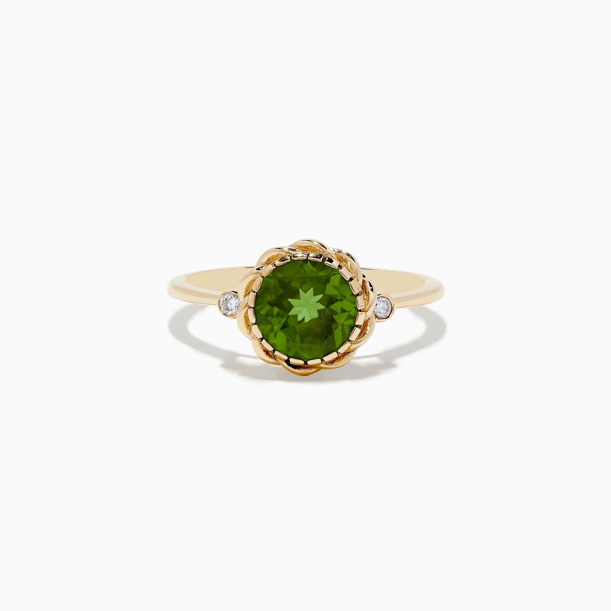 The 14K Yellow Gold Peridot and Diamond Ring showcases a round Peridot center stone with two small diamonds on each side, displayed against a white background.