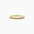 An 18K yellow gold half eternity band ring, featuring 0.13 TCW of sparkling yellow diamonds, is displayed against a plain white background.