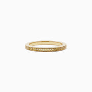 An 18K yellow gold half eternity band ring, featuring 0.13 TCW of sparkling yellow diamonds, is displayed against a plain white background.