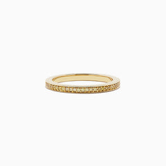 An 18K yellow gold half eternity band ring, featuring 0.13 TCW of sparkling yellow diamonds, is displayed against a plain white background.