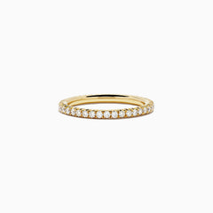 An 18K Yellow Gold Yellow Diamond Eternity Band, 0.54 TCW, featuring a continuous circle of small yellow diamonds, is shown on a plain white background.