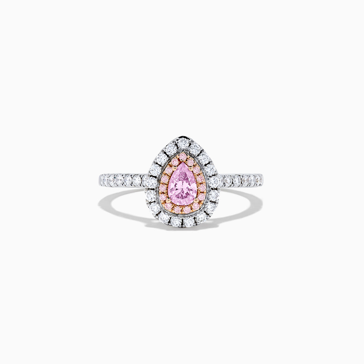 A teardrop-shaped 18K two tone gold ring features a GIA certified pink diamond (0.71 TCW) with a double halo of white and pink diamonds, set on a white diamond band, displayed against a white background.