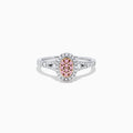 The 18K Two Tone Gold Pink and White Diamond Ring, 0.37 TCW, features an oval pink diamond cluster center, surrounded by white diamonds and accented with additional white diamonds along the band.