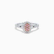 The 18K Two Tone Gold Pink and White Diamond Ring, 0.37 TCW, features an oval pink diamond cluster center, surrounded by white diamonds and accented with additional white diamonds along the band.