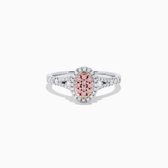 The 18K Two Tone Gold Pink and White Diamond Ring, 0.37 TCW, features an oval pink diamond cluster center, surrounded by white diamonds and accented with additional white diamonds along the band.