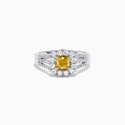 The 14K Two Tone Gold Yellow and White Diamond Ring features a cushion-cut yellow center stone, white diamond halo, split shank band, and a total weight of 1.22 TCW.