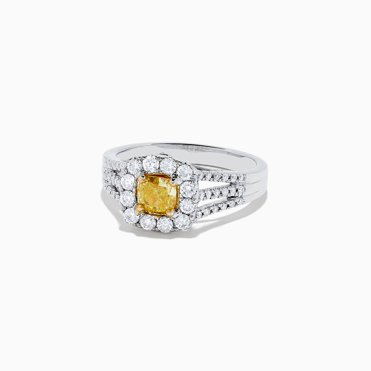 The 14K Two Tone Gold Yellow and White Diamond Ring features a cushion-cut yellow center stone, white diamond halo, split shank band, and a total weight of 1.22 TCW.