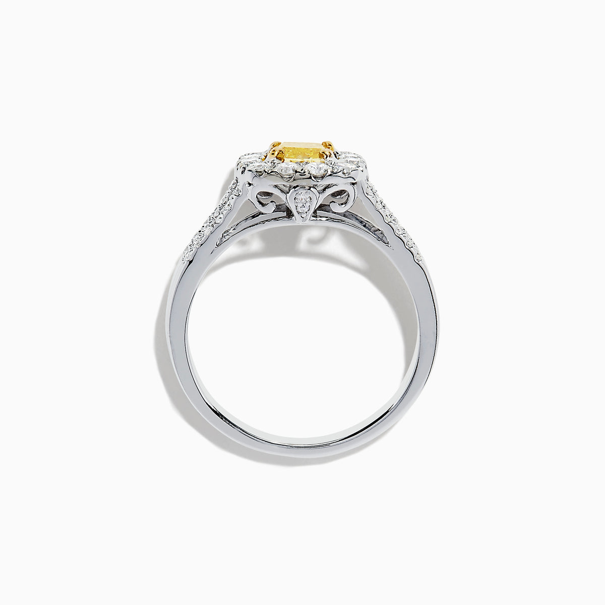 The 14K Two Tone Gold Yellow and White Diamond Ring features a cushion-cut yellow center stone, white diamond halo, split shank band, and a total weight of 1.22 TCW.
