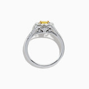 The 14K Two Tone Gold Yellow and White Diamond Ring features a cushion-cut yellow center stone, white diamond halo, split shank band, and a total weight of 1.22 TCW.
