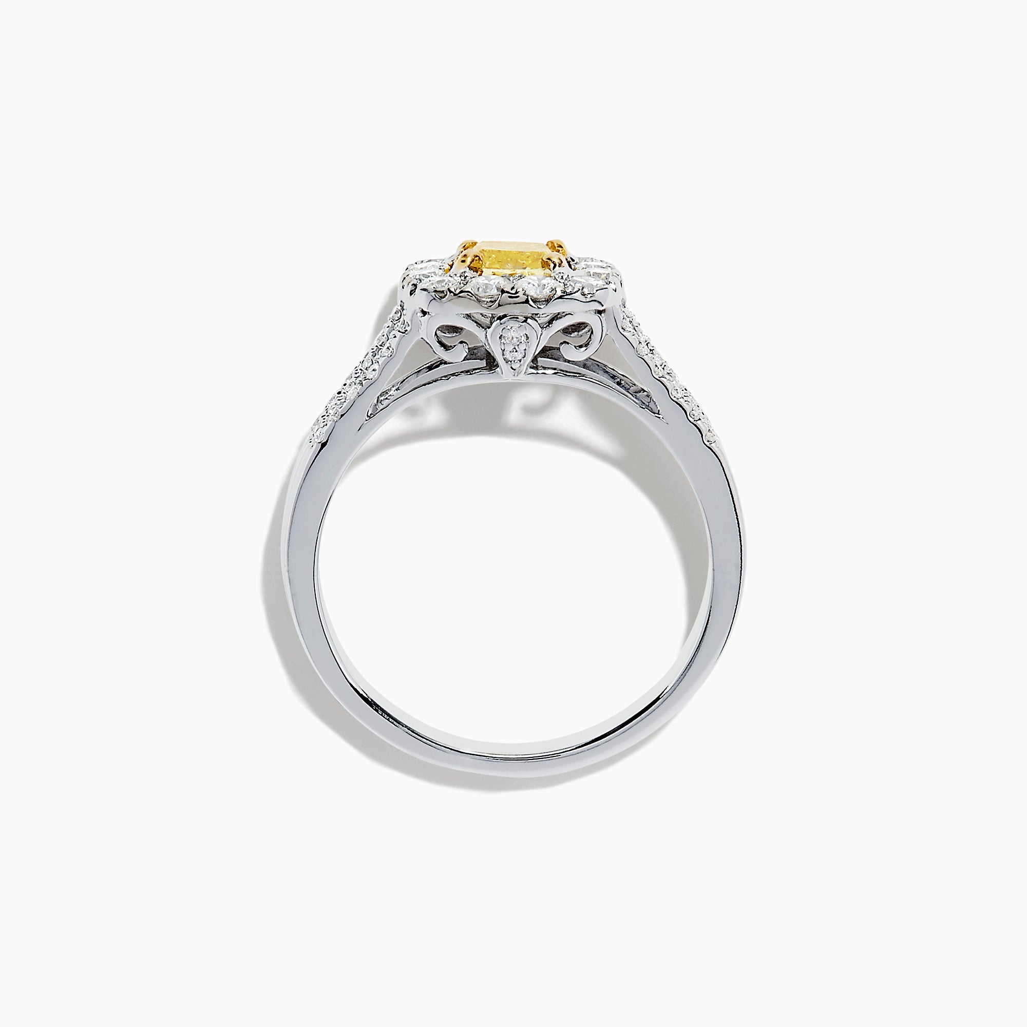 The 14K Two Tone Gold Yellow and White Diamond Ring features a cushion-cut yellow center stone, white diamond halo, split shank band, and a total weight of 1.22 TCW.