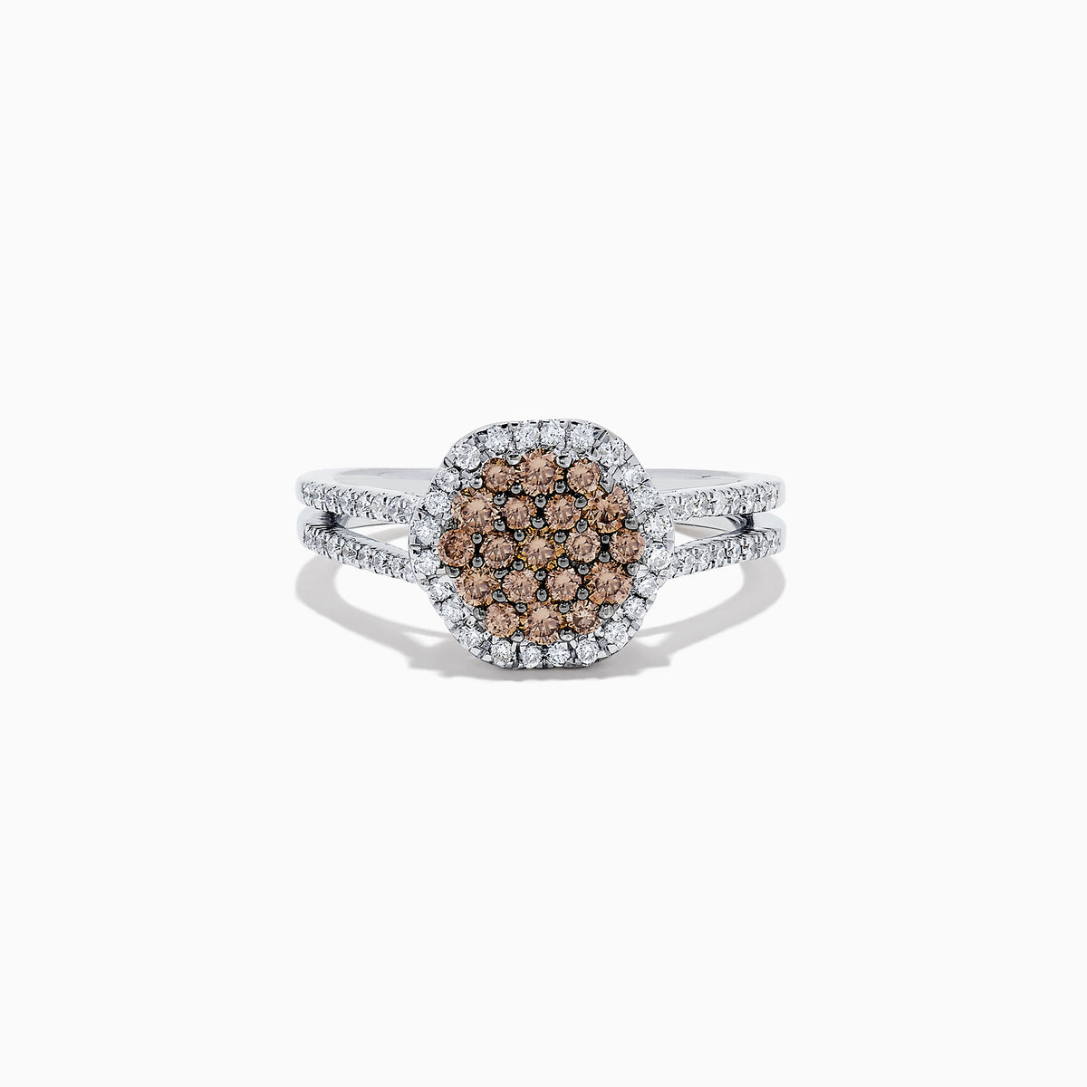 This 14K White Gold Espresso and White Diamond Ring features a split shank and a 1.50 TCW cluster of round brown diamonds at the center, surrounded by a halo of sparkling white diamonds.