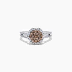 This 14K White Gold Espresso and White Diamond Ring features a split shank and a 1.50 TCW cluster of round brown diamonds at the center, surrounded by a halo of sparkling white diamonds.