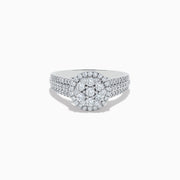 The 14K White Gold Diamond Cluster Ring, 0.95 TCW, features a round center cluster, double diamond halos, and a triple-row band for exceptional brilliance.