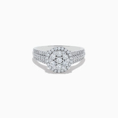 The 14K White Gold Diamond Cluster Ring, 0.95 TCW, features a round center cluster, double diamond halos, and a triple-row band for exceptional brilliance.