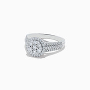 The 14K White Gold Diamond Cluster Ring, 0.95 TCW, features a round center cluster, double diamond halos, and a triple-row band for exceptional brilliance.