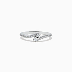 The 14k White Gold Diamond ring, 0.24 TCW, features a central round diamond on a curved band with sparkling accents and is displayed against a plain white background.