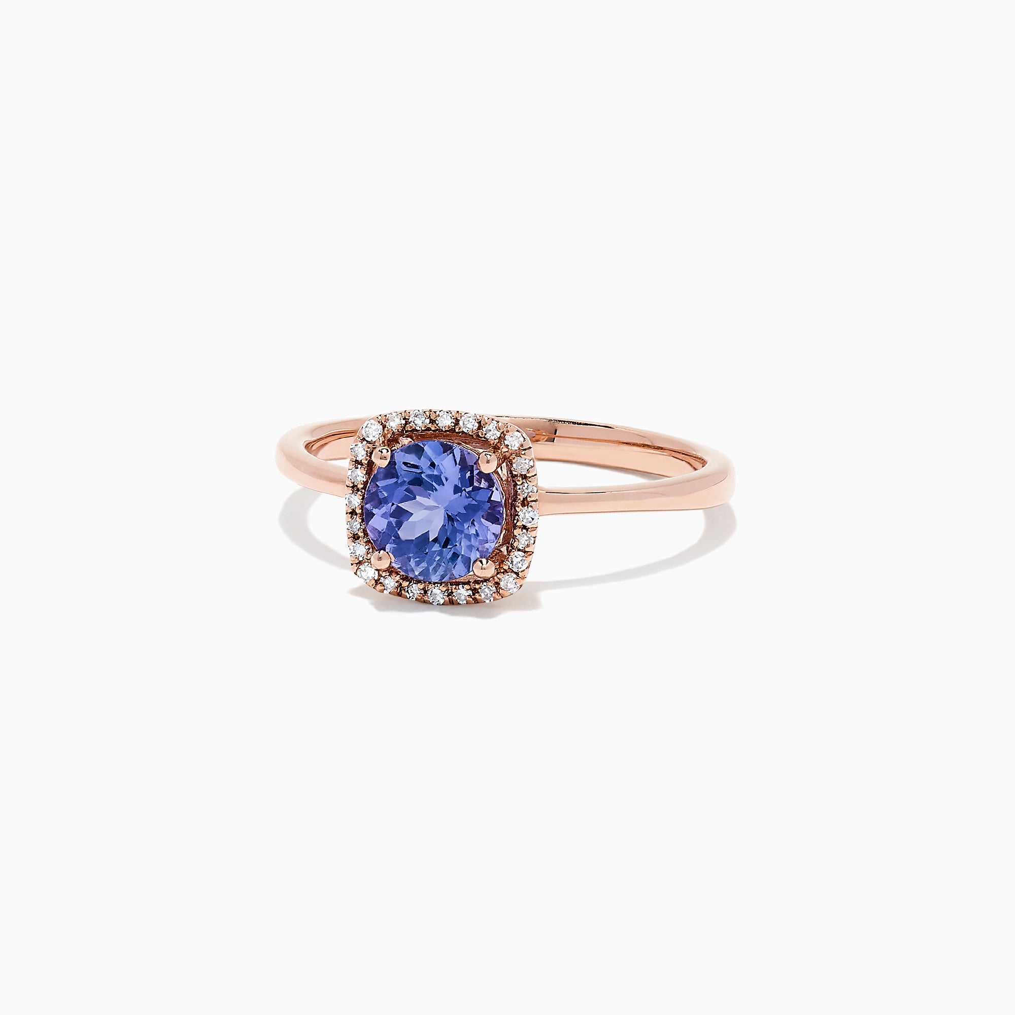 The Nahla Siri 14K Rose Gold Tanzanite and Diamond Ring (0.81 TCW) showcases a cushion-cut blue tanzanite encircled by a halo of clear diamonds, set against a white background.