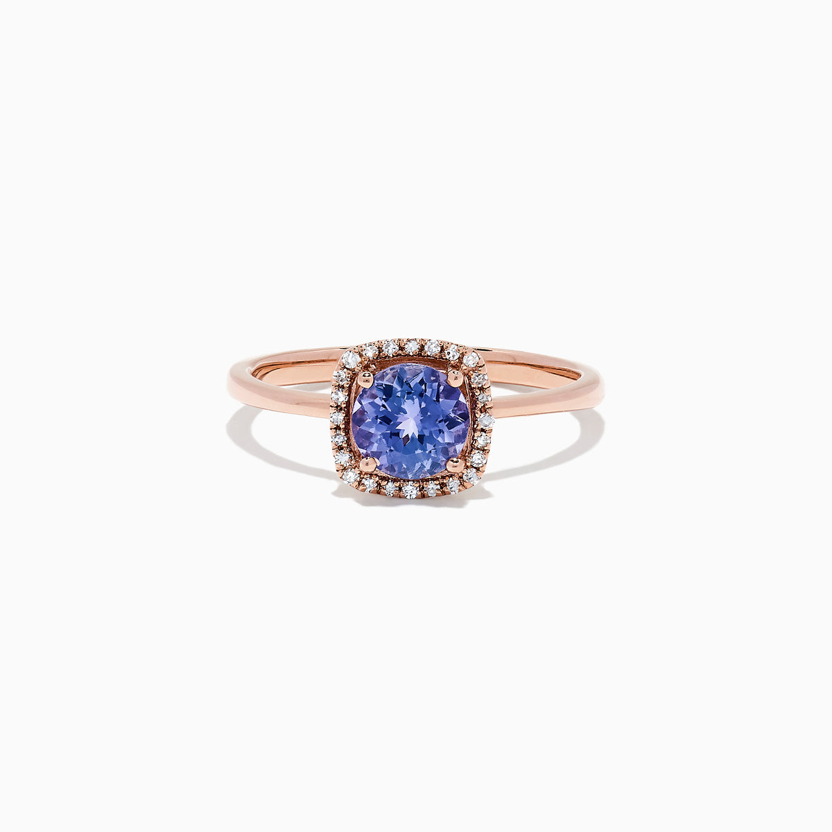 The Nahla Siri 14K Rose Gold Tanzanite and Diamond Ring (0.81 TCW) showcases a cushion-cut blue tanzanite encircled by a halo of clear diamonds, set against a white background.