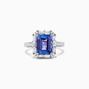The Nahla Siri 14K White Gold Tanzanite and Diamond Ring, 5.03 TCW, features a large rectangular blue tanzanite center stone surrounded by a halo of baguette and round diamonds in an elegant, intricate design.