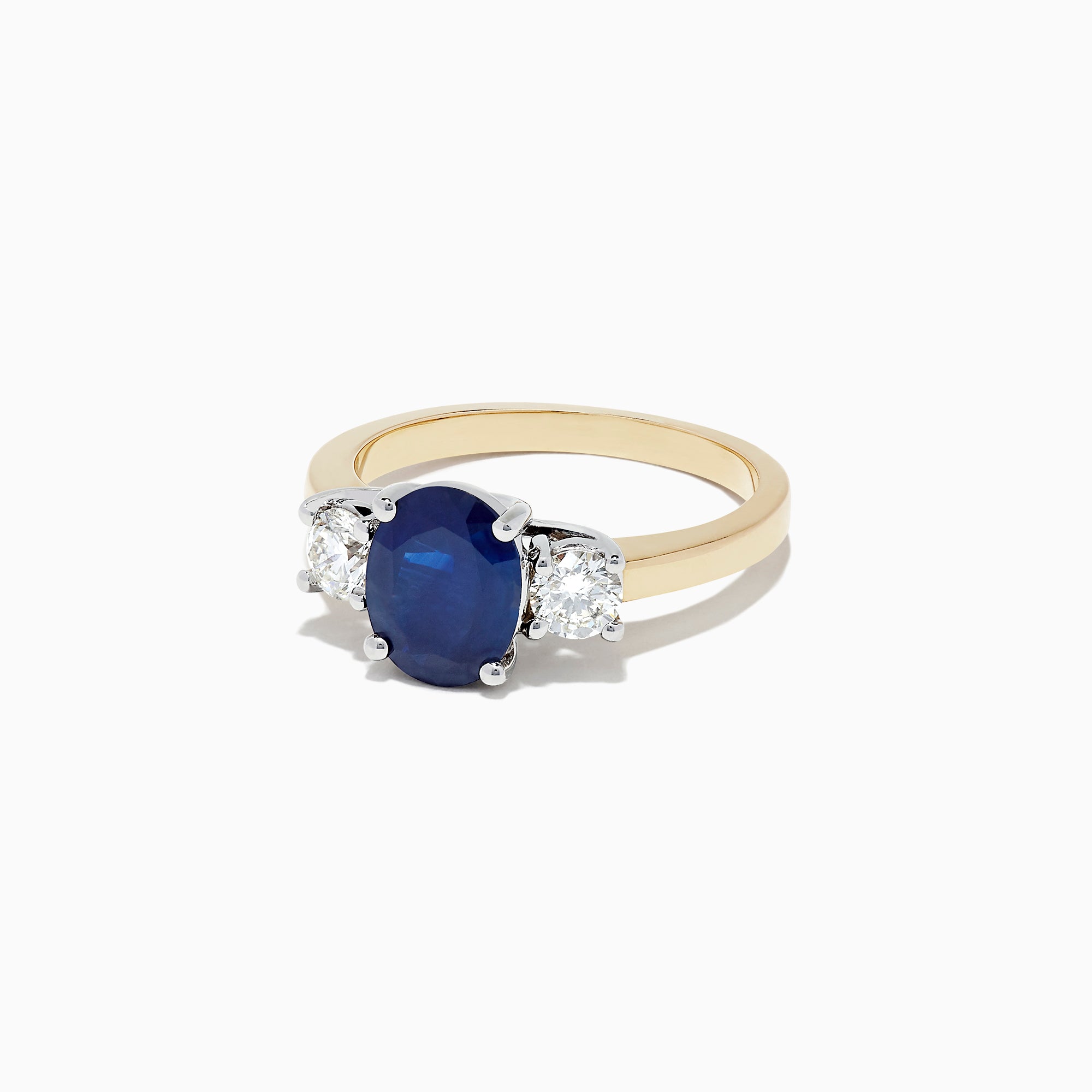 The Royale Bleu 14K Two Tone Gold Sapphire and Diamond Ring, 2.39 TCW, features an oval blue sapphire between two oval white diamonds, set in luxurious gold and shown on a white background.