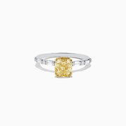 Experience elegance with the Canare 18K Gold Yellow Diamond Engagement & Wedding Ring Set, 2.57 TCW, showcasing a rectangular yellow diamond center and split gold band adorned with baguette clear stones on each side.